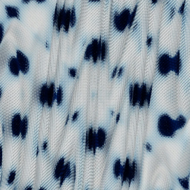the blue and white animal pattern on this shirt