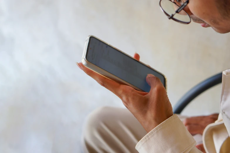 a woman is looking at her phone