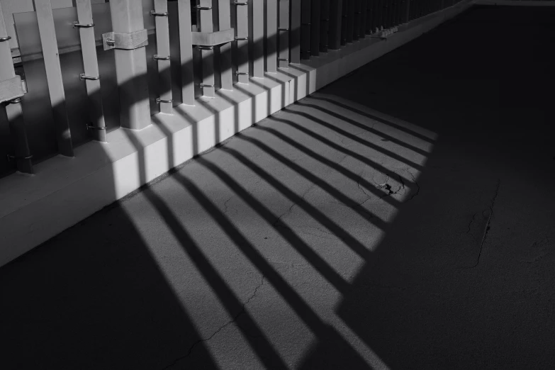 shadows cast on a wall on the ground