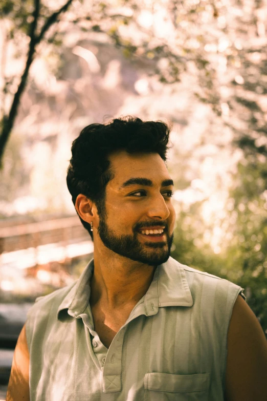 a man smiles for the camera and looks straight ahead