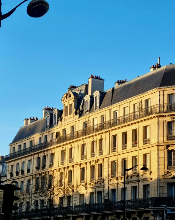 a city building with several windows on the top