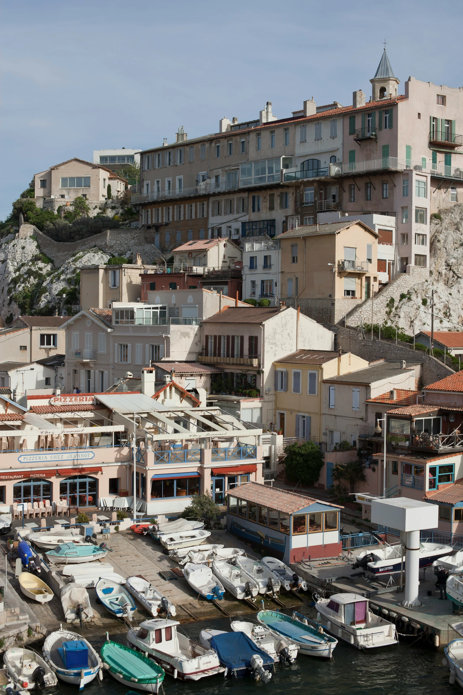 boats are parked in the harbor at a small village