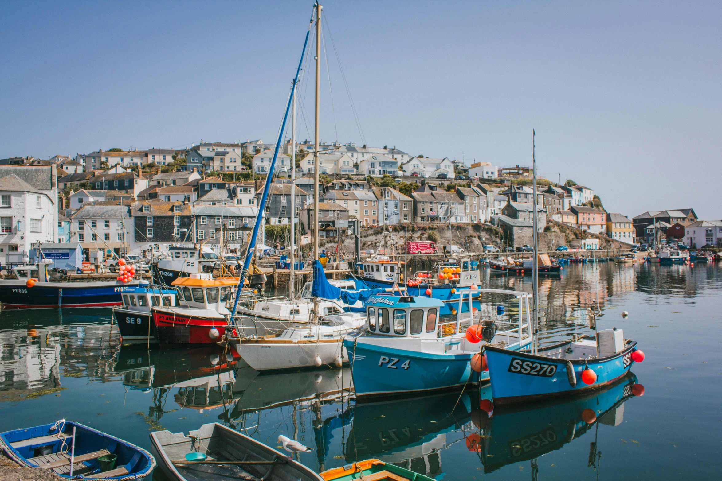 many boats are docked at the harbor