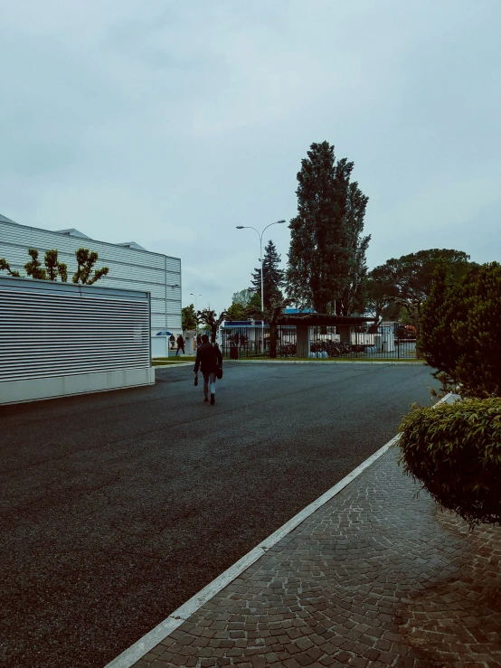 two people crossing the street in a city