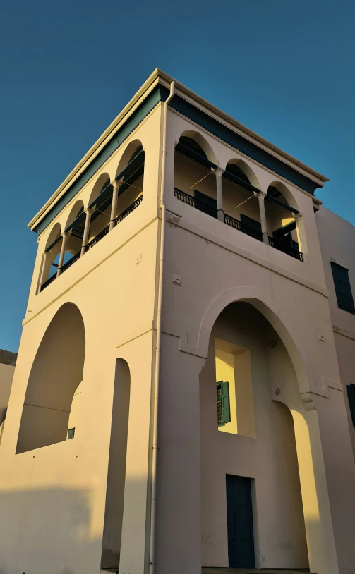 the front side of a building with arches and arches