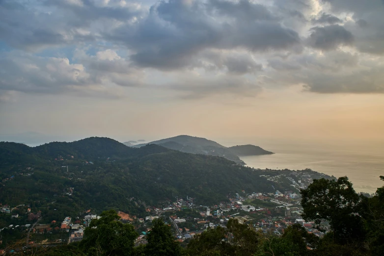 a view from the top of a hill looking down at the ocean