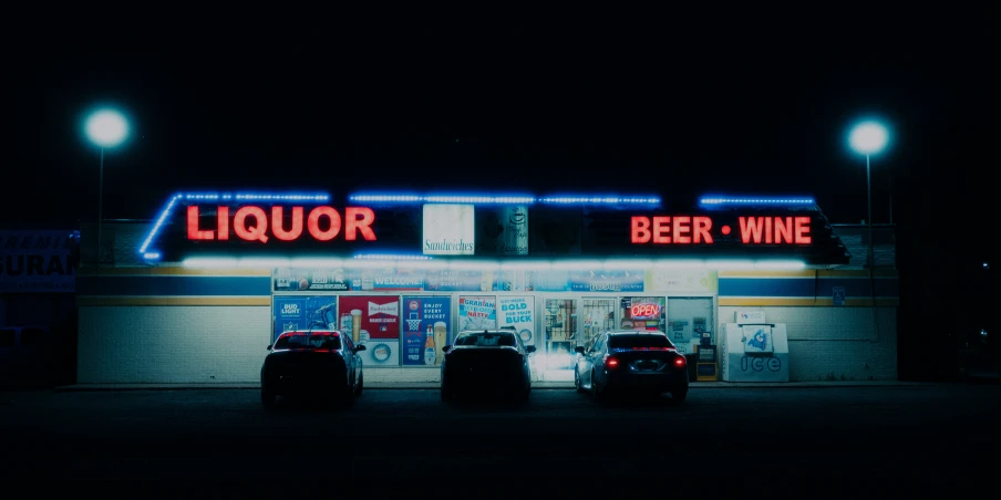 a beer shop sitting under a streetlight