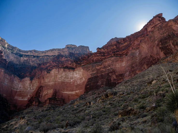 a cliff with a trail going up the side it