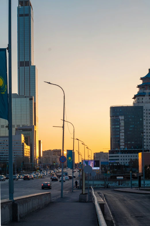 a city skyline and a highway in a sunset