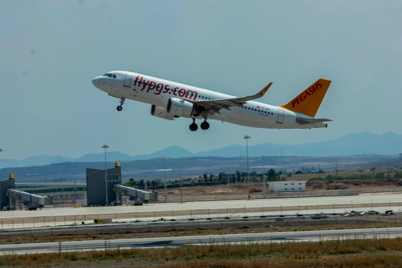 an air plane taking off from an airport runway