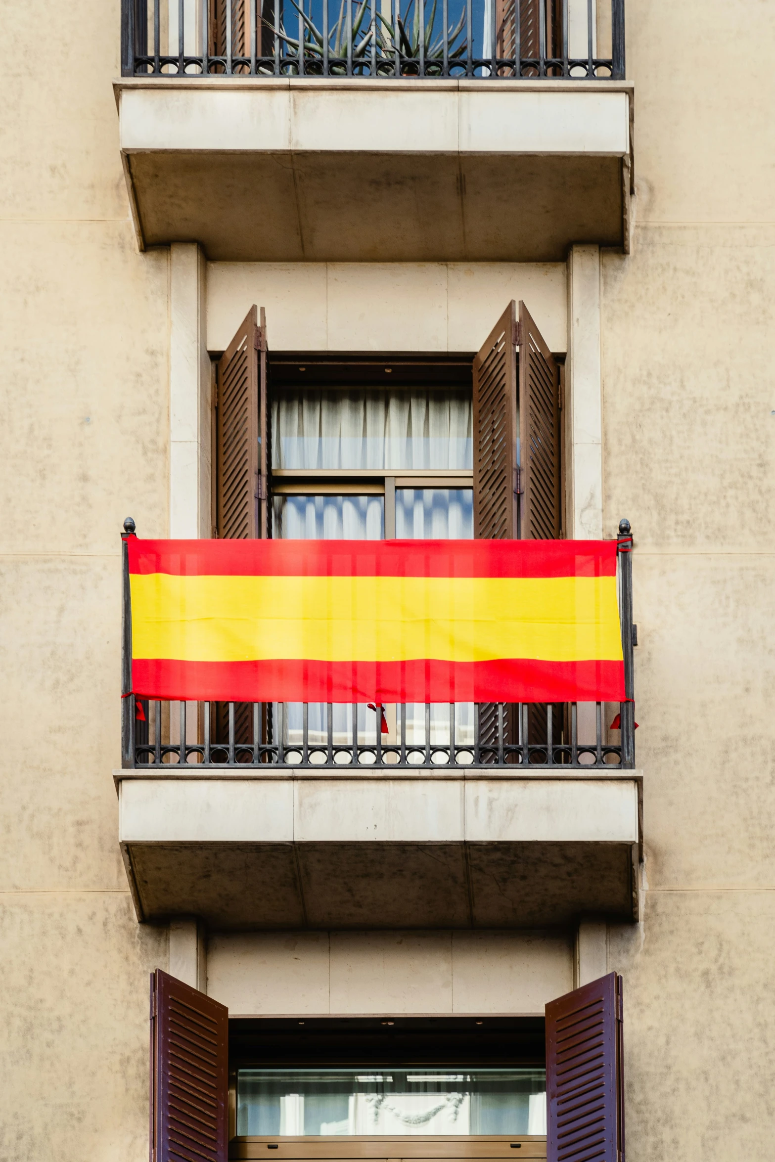 a large flag is hanging outside a building