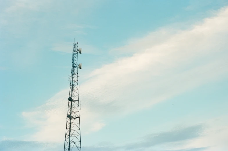 the very tall tower is on a clear day