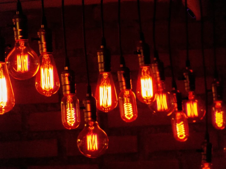 many light bulbs hanging from a roof
