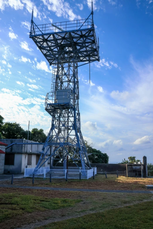 a tall tower in the middle of some buildings