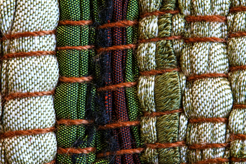 colorful woven material with red rope in the center