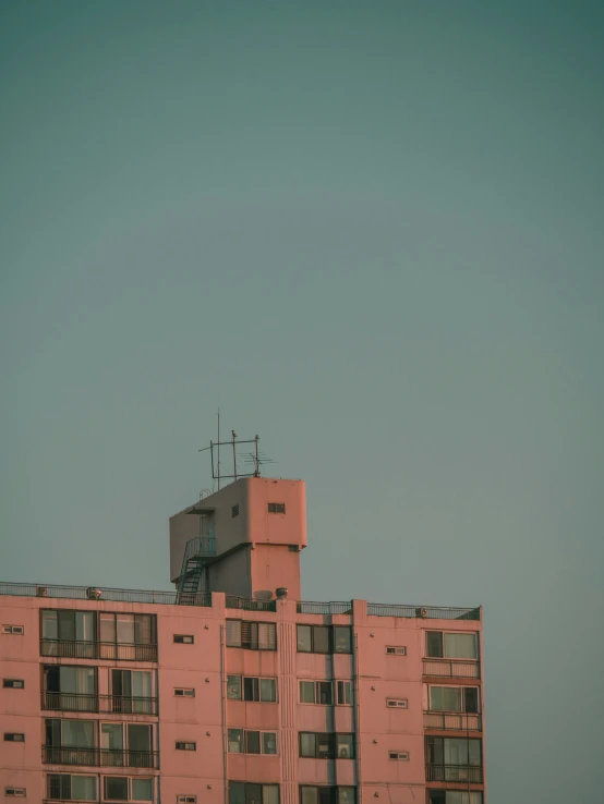 the view of buildings and a traffic light with a clear sky