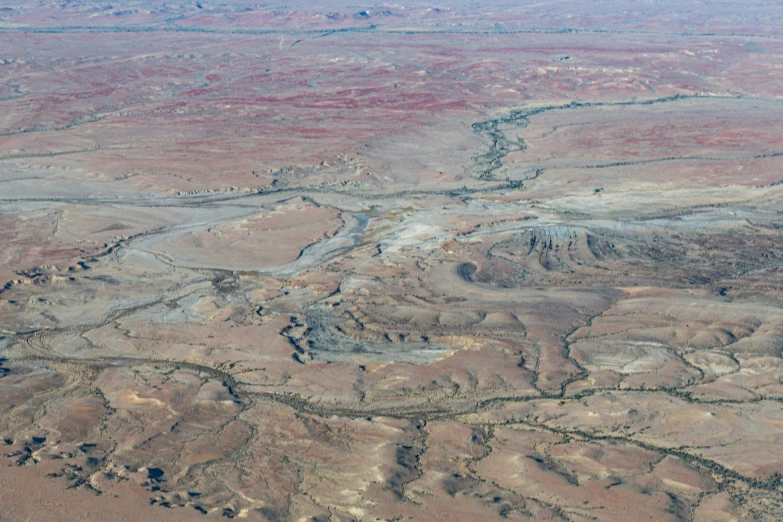 a very wide valley covered in dirt in a remote area