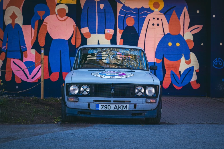 this car has been modified to make a colorful mural