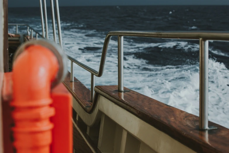 there is a boat in the ocean with large waves