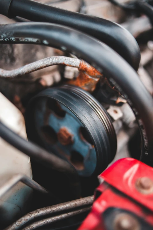 an old car engine with metal and rust