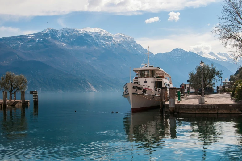 there is a boat that is docked at the dock