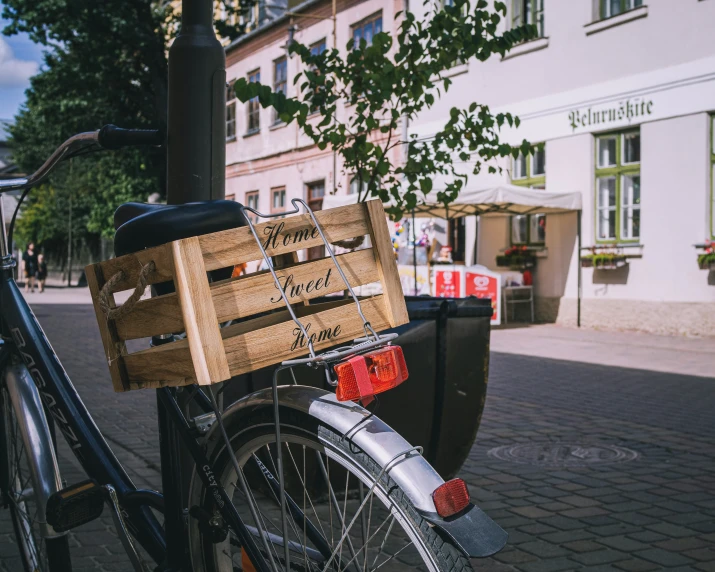 an old bicycle parked on the side of the street