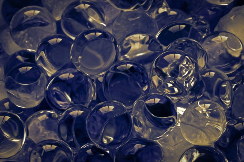 a pile of clear glass candlesticks laying next to each other