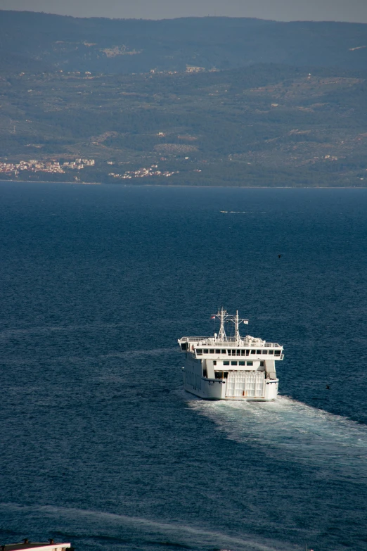 a boat sailing on the open blue water