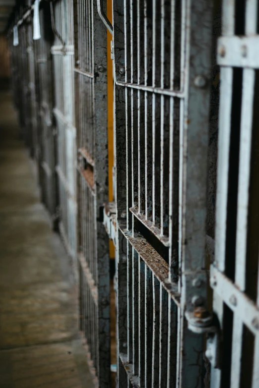 a prison cell with bars on the doors