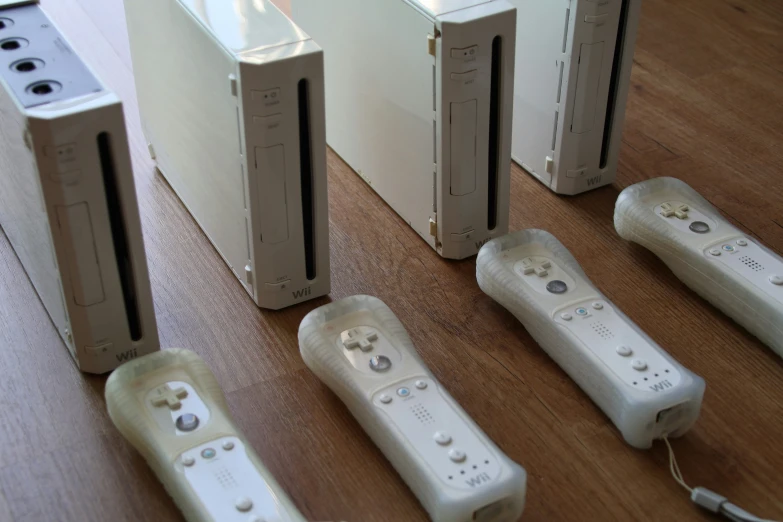 white nintendo wii game controllers and one without