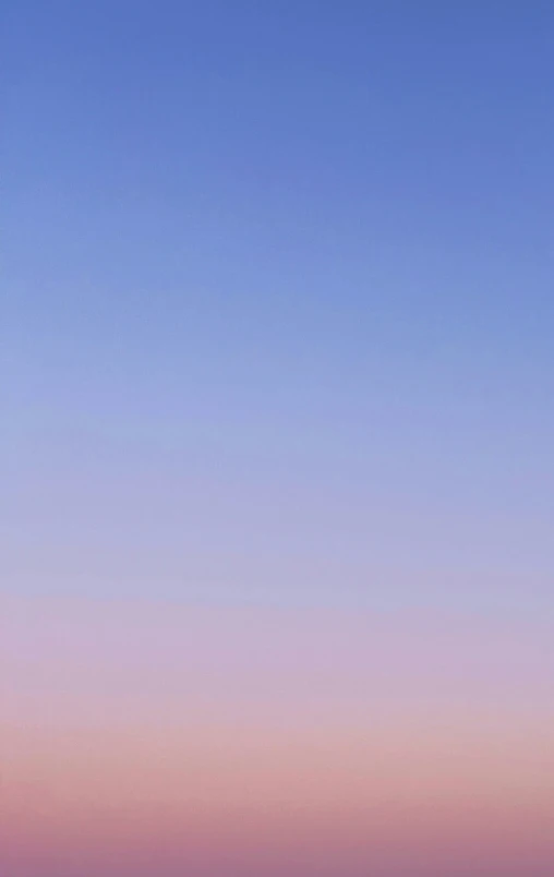 a pink and blue cloudy sky with two planes