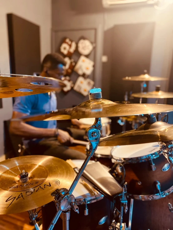 a musician is playing drums in a studio