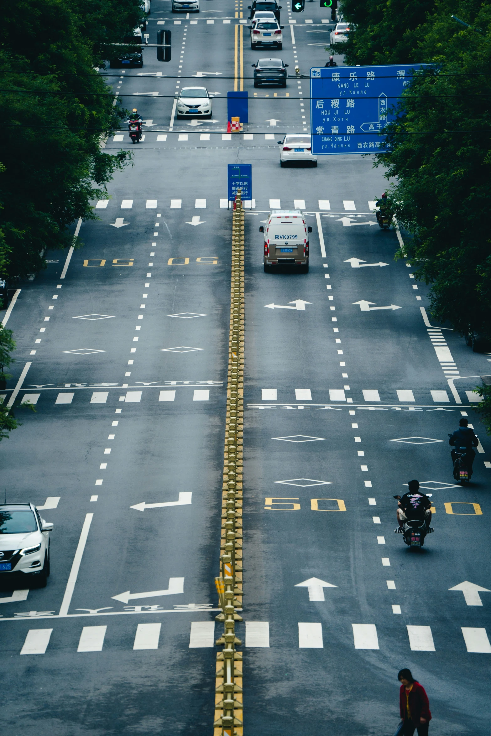 an aerial view of a city street with cars on it