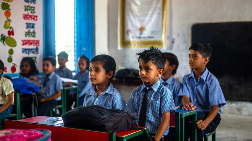 the students are sitting in their classroom at this desk