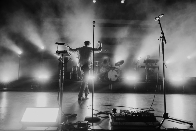 a band of people standing on top of a stage