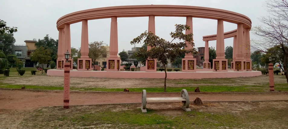 a circle - like area near the trees with benches