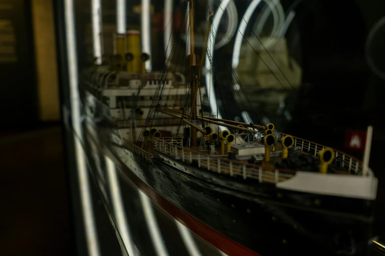 a toy ship is displayed in a store window