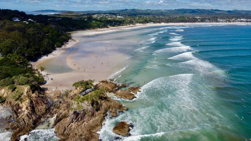 this is an aerial view of a beach and ocean