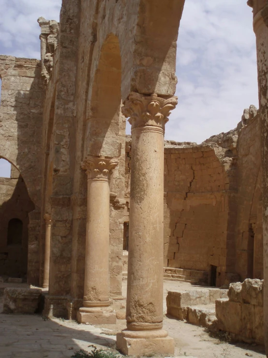 a couple of pillars near a building