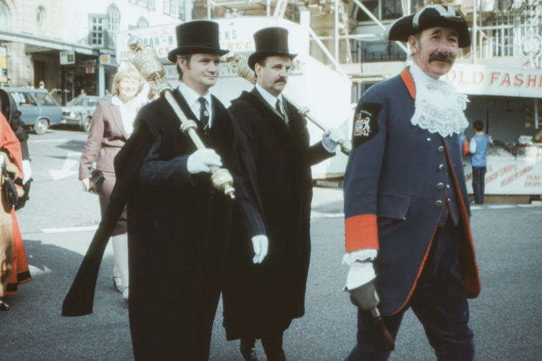 two men dressed in fancy costumes walk together