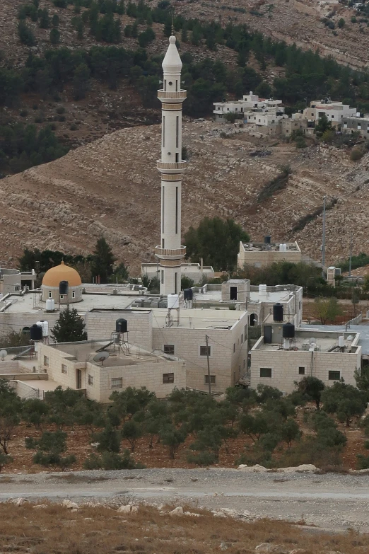 a town that has an old white tower on it