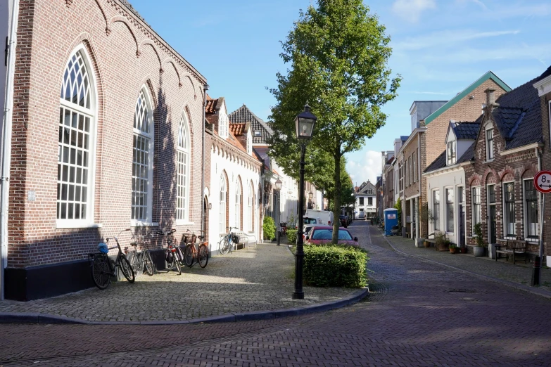 a view down a brick street that has many buildings