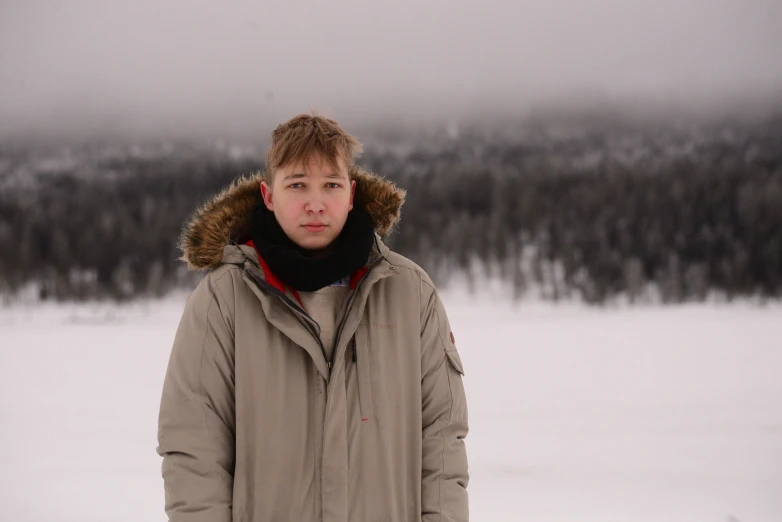 a guy that is standing in the snow