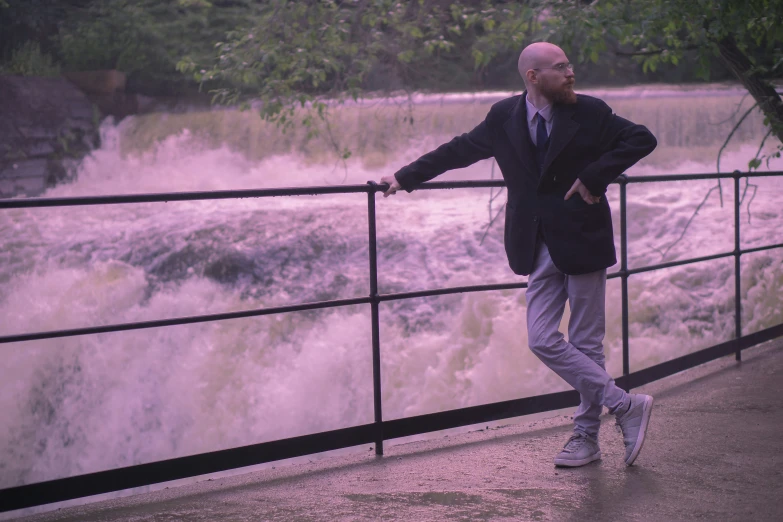 a man looks out over the water that is running on it