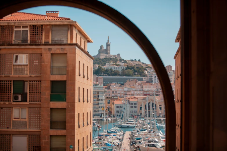 a port filled with lots of boats next to a building