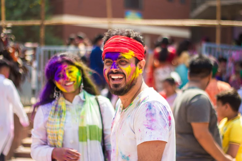 a group of people in a group painted in colors