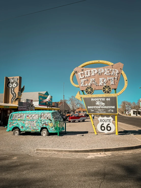 there is a van parked at the edge of a desert