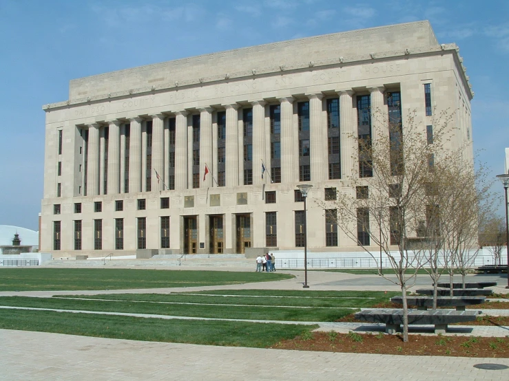 a large white building with columns and several windows