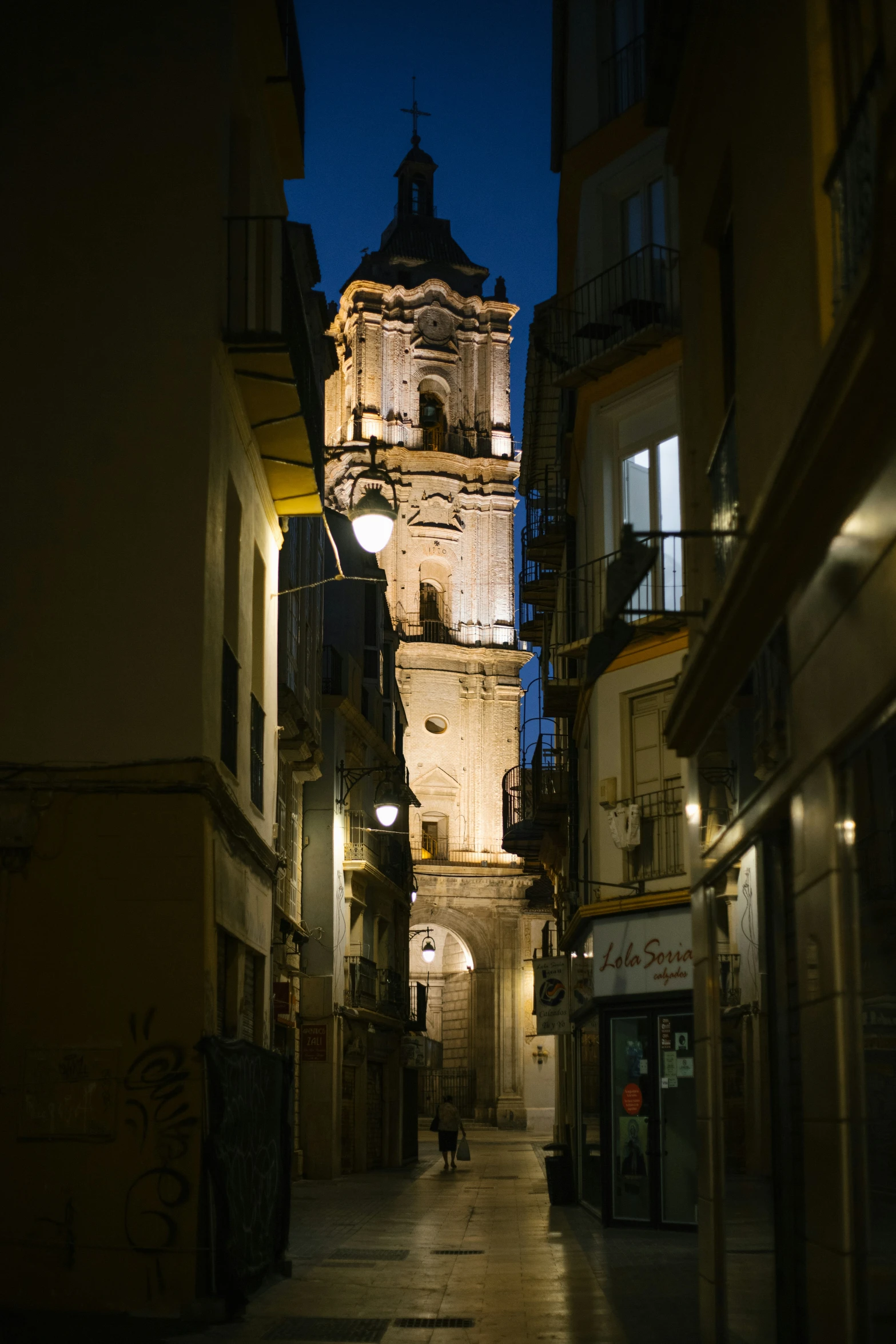 an old street with lots of lights at night