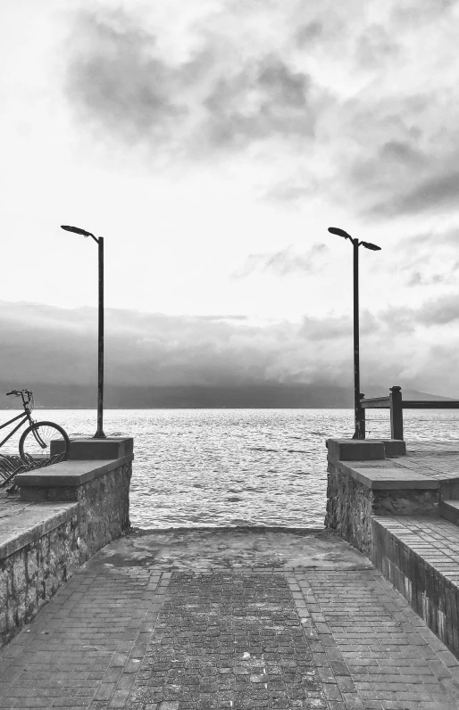 a bench with a bike parked on it and three lights attached to the bench